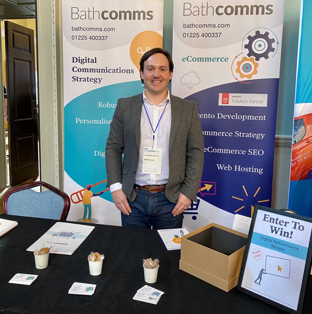 Jonathan Sherwin standing at the Bathcomms stand at the Bath Business Expo